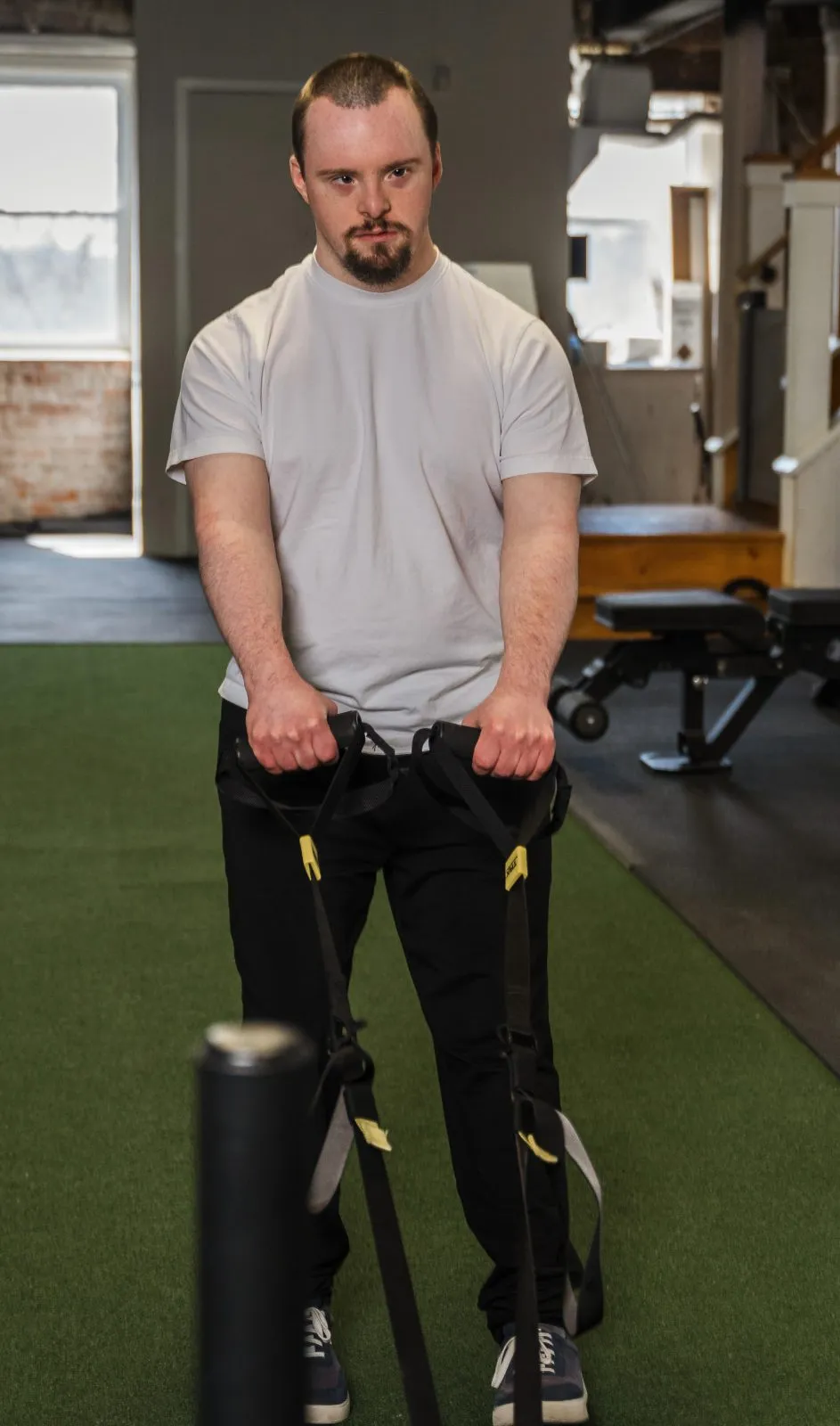 An athlete doing a suspension-strap row